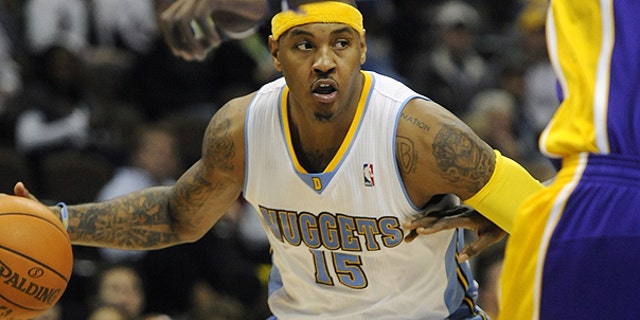 Nov. 11: Denver Nuggets forward Carmelo Anthony brings the ball up the floor in the second half of an NBA basketball game against the Los Angeles Lakers in Denver.