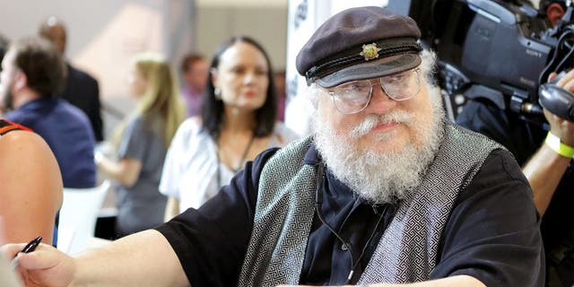 SAN DIEGO, CA - JULY 25: Writer George R.R. Martin of "Game of Thrones" signs autographs during the 2014 Comic-Con International Convention-Day 3 at the San Diego Convention Center on July 25, 2014 in San Diego, California. (Photo by Tiffany Rose/Getty Images)