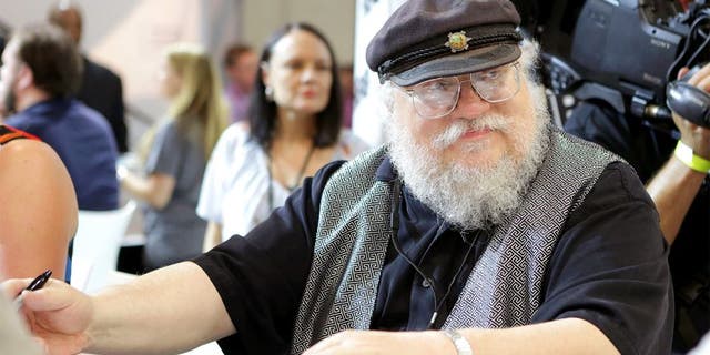 SAN DIEGO, CA - JULY 25: Writer George R.R. Martin of "Game of Thrones" signs autographs during the 2014 Comic-Con International Convention-Day 3 at the San Diego Convention Center on July 25, 2014 in San Diego, California. (Photo by Tiffany Rose/Getty Images)
