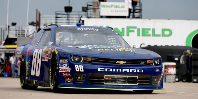 FORT WORTH, TX - APRIL 09: Dale Earnhardt Jr., driver of the #88 Goody's Chevrolet, goes through the garage area during practice for the NASCAR XFINITY Series O'Reilly Auto Parts 300 at Texas Motor Speedway on April 9, 2015 in Fort Worth, Texas. (Photo by Sarah Glenn/Getty Images for Texas Motor Speedway)