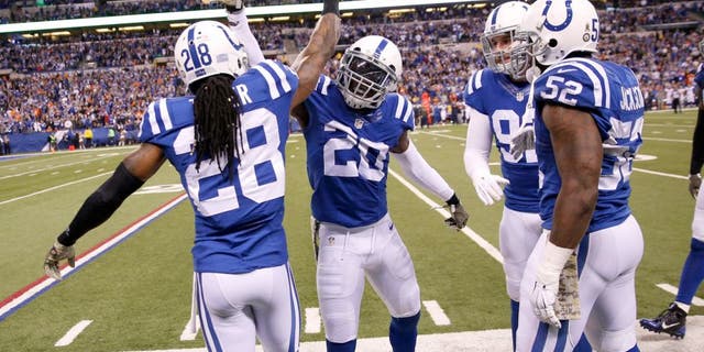 Nov 8, 2015; Indianapolis, IN, USA; Indianapolis Colts cornerback Darius Butler (20) is congratulated by his teammates after making an interception against the Denver Broncos in the 4th quarter at Lucas Oil Stadium. Indianapolis defeats Denver 27-24. Mandatory Credit: Brian Spurlock-USA TODAY Sports