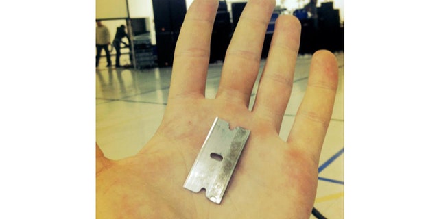 The razor blade Jonathan handed over to Nick Hall.