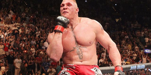 LAS VEGAS - JULY 03: Brock Lesnar reacts after his second round submission victory against Shane Carwin to win the UFC Heavyweight Championship Unification bout at the MGM Grand Garden Arena on July 3, 2010 in Las Vegas, Nevada. (Photo by Josh Hedges/Zuffa LLC/Zuffa LLC via Getty Images) *** Local Caption *** Brock Lesnar
