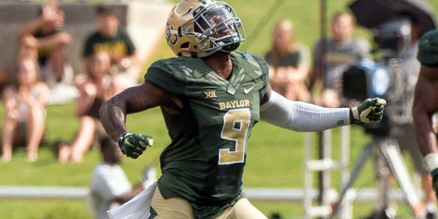 Sep 26, 2015; Waco, TX, USA; Baylor Bears cornerback Ryan Reid (9) celebrates blocking a field goal attempt by the Rice Owls during the second quarter at McLane Stadium. Mandatory Credit: Jerome Miron-USA TODAY Sports