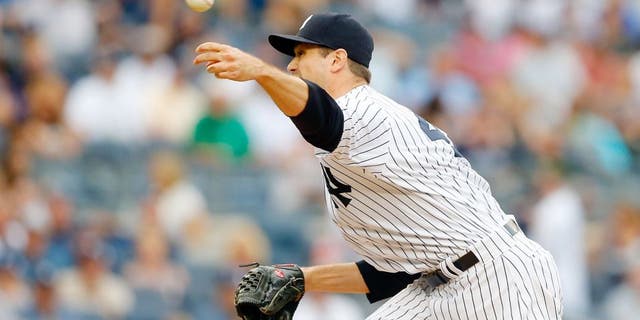 NEW YORK, NY - SEPTEMBER 12: Andrew Miller #48 of the New York Yankees in action against the Toronto Blue Jays at Yankee Stadium on September 12, 2015 in the Bronx borough of New York City. The Jays defeated the Yankees 9-5 after eleven innings. (Photo by Jim McIsaac/Getty Images)