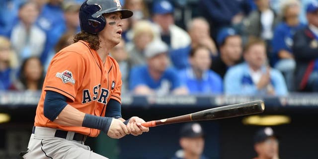 Oct 9, 2015; Kansas City, MO, USA; Houston Astros left fielder Colby Rasmus hits a RBI double against the Kansas City Royals in the first inning in game two of the ALDS at Kauffman Stadium. Mandatory Credit: Peter G. Aiken-USA TODAY Sports