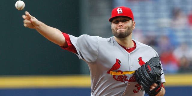Oct 4, 2015; Atlanta, GA, USA; St. Louis Cardinals starting pitcher Lance Lynn (31) throws a pitch against the Atlanta Braves in the first inning at Turner Field. Mandatory Credit: Brett Davis-USA TODAY Sports