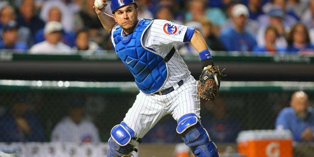 October 20, 2015; Chicago, IL, USA; Chicago Cubs relief catcher Miguel Montero (47) throws to first in the sixth inning against the New York Mets in game three of the NLCS at Wrigley Field. Mandatory Credit: Dennis Wierzbicki-USA TODAY Sports