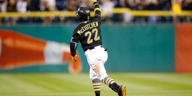 PITTSBURGH, PA - JULY 11: Andrew McCutchen #22 of the Pittsburgh Pirates reacts after hitting the game-winning two run home run in the 14th inning against the St Louis Cardinals during the game at PNC Park on July 11, 2015 in Pittsburgh, Pennsylvania. (Photo by Jared Wickerham/Getty Images)