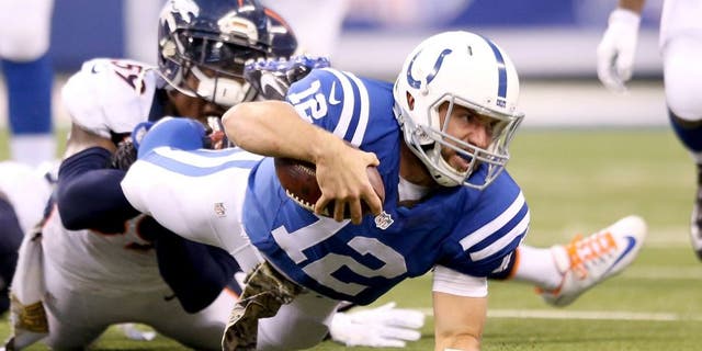 INDIANAPOLIS, IN - NOVEMBER 08: Andrew Luck #12 of the Indianapolis Colts runs with the ball during the game against the Denver Broncos at Lucas Oil Stadium on November 8, 2015 in Indianapolis, Indiana. (Photo by Andy Lyons/Getty Images)