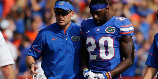 Nov 12, 2016; Gainesville, FL, USA; Florida Gators defensive back Marcus Maye (20) leaves the game with an apparent injury against the South Carolina Gamecocks during the first quarter at Ben Hill Griffin Stadium. Mandatory Credit: Kim Klement-USA TODAY Sports
