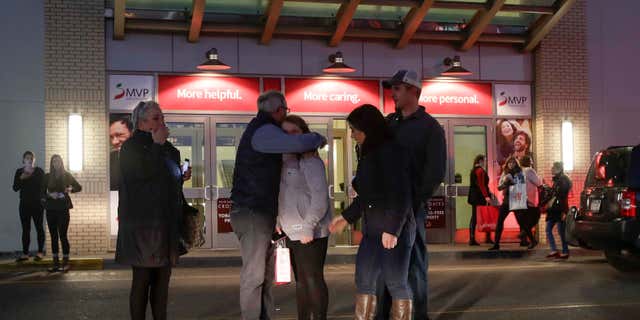 Nov. 12, 2016: People embrace after leaving Crossgates Mall in Guilderland, N.Y., after reports of gunfire inside.