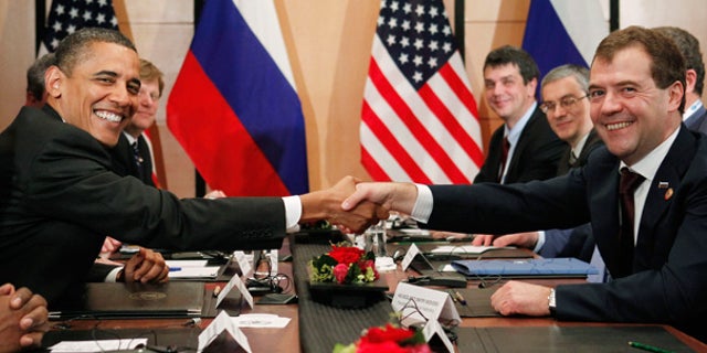 Nov. 14: President Obama shakes hands with President Dmitry Medvedev of Russia on the sidelines of the APEC summit in Yokohama, Japan.