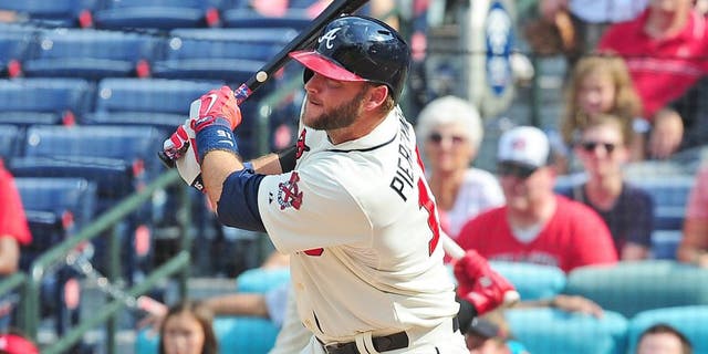 ATLANTA, GA - SEPTEMBER 20: A. J. Pierzynski #15 of the Atlanta Braves knocks in the game-winning run with a ninth inning single against the Philadelphia Philiies at Turner Field on September 20, 2015 in Atlanta, Georgia. (Photo by Scott Cunningham/Getty Images)