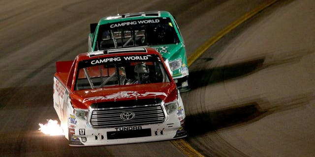 AVONDALE, AZ - NOVEMBER 13: Timothy Peters, driver of the #17 Red Horse Racing Toyota, leads Johnny Sauter, driver of the #98 Smokey Mountain/Curb Records Toyota, during the NASCAR Camping World Truck Series Lucas Oil 150 at Phoenix International Raceway on November 13, 2015 in Avondale, Arizona. (Photo by Sean Gardner/Getty Images)