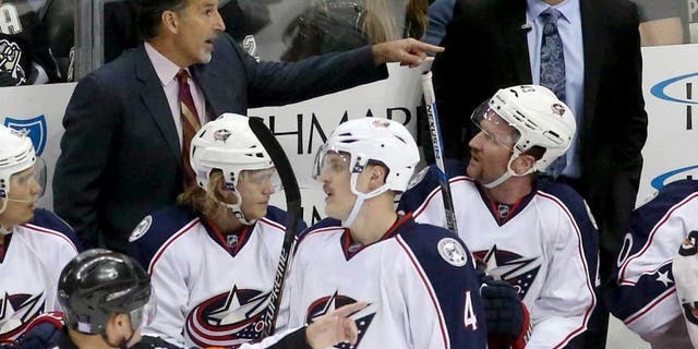 Nov 13, 2015; Pittsburgh, PA, USA; Columbus Blue Jackets head coach John Tortorella (left rear) gestures during a time-out against the Pittsburgh Penguins in the second period at the CONSOL Energy Center. The Blue Jackets won 2-1. Mandatory Credit: Charles LeClaire-USA TODAY Sports