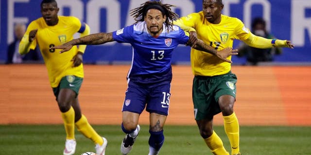 United Statesâ Jermaine Jones (13) controls the ball as St. Vincent and the Grenadinesâ Dorren Hamlet, left, and Seinard Bowens, right, defend during the first half of a 2018 World Cup qualifying soccer match Friday, Nov. 13, 2015, in St. Louis. (AP Photo/Jeff Roberson)