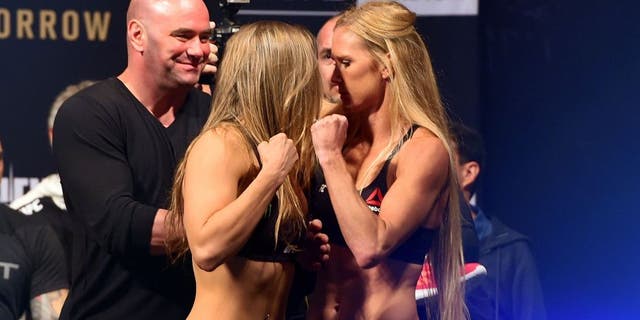 MELBOURNE, AUSTRALIA - NOVEMBER 14: (L-R) Opponents Ronda Rousey of the United States and Holly Holm of the United States face off during the UFC 193 weigh-in at Etihad Stadium on November 14, 2015 in Melbourne, Australia. (Photo by Josh Hedges/Zuffa LLC/Zuffa LLC via Getty Images)