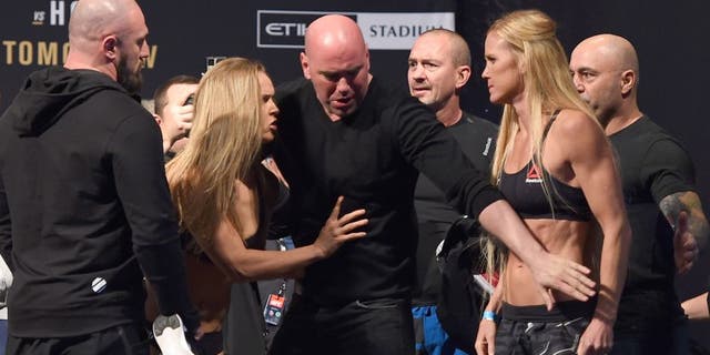 MELBOURNE, AUSTRALIA - NOVEMBER 14: (L-R) Opponents Ronda Rousey of the United States and Holly Holm of the United States face off during the UFC 193 weigh-in at Etihad Stadium on November 14, 2015 in Melbourne, Australia. (Photo by Josh Hedges/Zuffa LLC/Zuffa LLC via Getty Images)