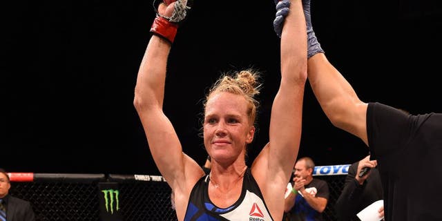 SAN DIEGO, CA - JULY 15: Holly Holm celebrates her victory over Marion Reneau in their women's bantamweight bout during the UFC event at the Valley View Casino Center on July 15, 2015 in San Diego, California. (Photo by Jeff Bottari/Zuffa LLC/Zuffa LLC via Getty Images)