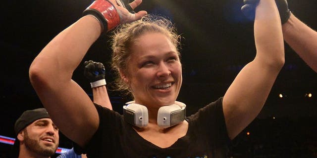 ANAHEIM, CA - FEBRUARY 23: Ronda Rousey reacts to her victory over Liz Carmouche in their women's bantamweight title fight during UFC 157 at Honda Center on February 23, 2013 in Anaheim, California. (Photo by Donald Miralle/Zuffa LLC/Zuffa LLC via Getty Images)
