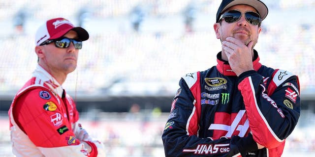 DAYTONA BEACH, FL - FEBRUARY 15: Kevin Harvick, driver of the #4 Budweiser/Jimmy John's Chevrolet, and Kurt Busch, driver of the #41 Haas Automation Chevrolet, stands on the grid during qualifying for the 57th Annual Daytona 500 at Daytona International Speedway on February 15, 2015 in Daytona Beach, Florida. (Photo by Robert Laberge/NASCAR via Getty Images)