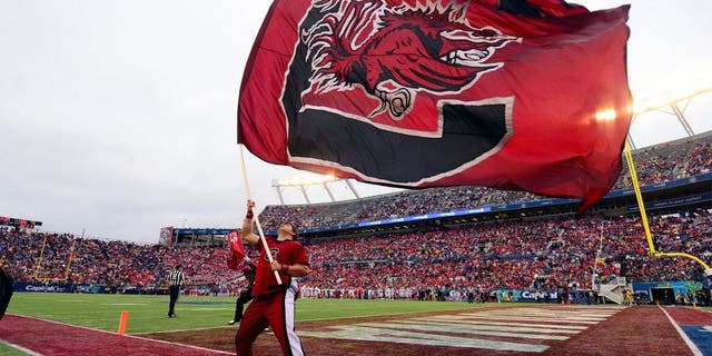 Jan 1, 2014; Orlando, FL, USA; The South Carolina Gamecocks flag flies after a score as they beat the Wisconsin Badgers 34-24 in the Capital One Bowl at Florida Citrus Bowl. Mandatory Credit: David Manning-USA TODAY Sports