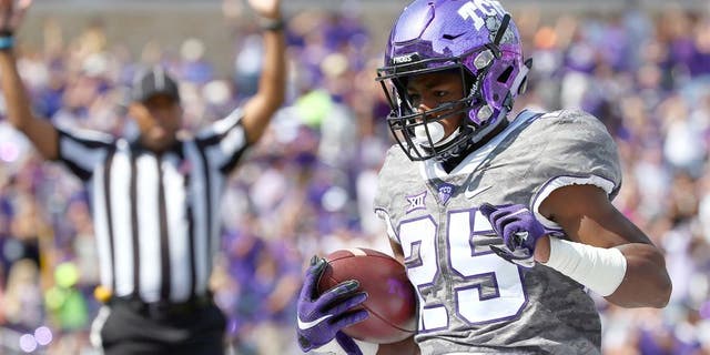 FORT WORTH, TX - OCTOBER 03: KaVontae Turpin #25 of the TCU Horned Frogs scores a touchdown against the Texas Longhorns in the first half at Amon G. Carter Stadium on October 3, 2015 in Fort Worth, Texas. (Photo by Tom Pennington/Getty Images)