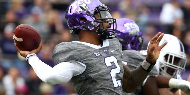 FORT WORTH, TX - NOVEMBER 14: Trevone Boykin #2 of the TCU Horned Frogs looks for an open receiver against the Kansas Jayhawks in the first quarter at Amon G. Carter Stadium on November 14, 2015 in Fort Worth, Texas. (Photo by Tom Pennington/Getty Images)