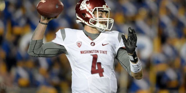 Nov 14, 2015; Pasadena, CA, USA; Washington State Cougars quarterback Luke Falk (4) throws a pass against the UCLA Bruins in a NCAA football game at Rose Bowl. Mandatory Credit: Kirby Lee-USA TODAY Sports
