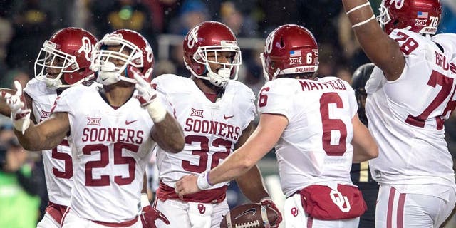 Nov 14, 2015; Waco, TX, USA; Oklahoma Sooners wide receiver Sterling Shepard (3) and running back Joe Mixon (25) and running back Samaje Perine (32) and quarterback Baker Mayfield (6) celebrate Perine's touchdown against the Baylor Bears during the first quarter at McLane Stadium. Mandatory Credit: Jerome Miron-USA TODAY Sports