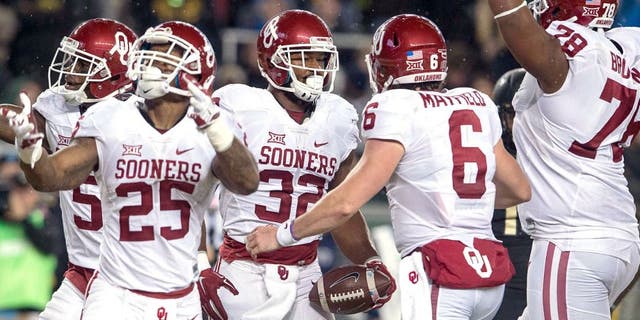 Nov 14, 2015; Waco, TX, USA; Oklahoma Sooners wide receiver Sterling Shepard (3) and running back Joe Mixon (25) and running back Samaje Perine (32) and quarterback Baker Mayfield (6) celebrate Perine's touchdown against the Baylor Bears during the first quarter at McLane Stadium. Mandatory Credit: Jerome Miron-USA TODAY Sports