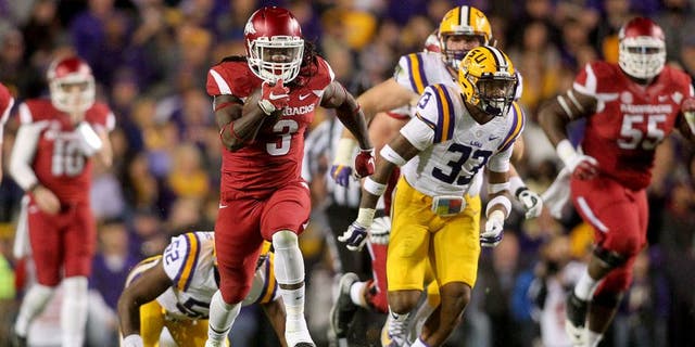Nov 14, 2015; Baton Rouge, LA, USA; Arkansas Razorbacks running back Alex Collins (3) carries the ball to score a touchdown against the LSU Tigers in the first half at Tiger Stadium. Mandatory Credit: Crystal LoGiudice-USA TODAY Sports