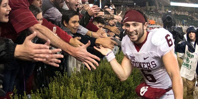 Nov 14, 2015; Waco, TX, USA; Oklahoma Sooners quarterback Baker Mayfield (6) celebrates with the Sooner fans after the win over the Baylor Bears at McLane Stadium. The Sooners defeat the Bears 44-34. Mandatory Credit: Jerome Miron-USA TODAY Sports
