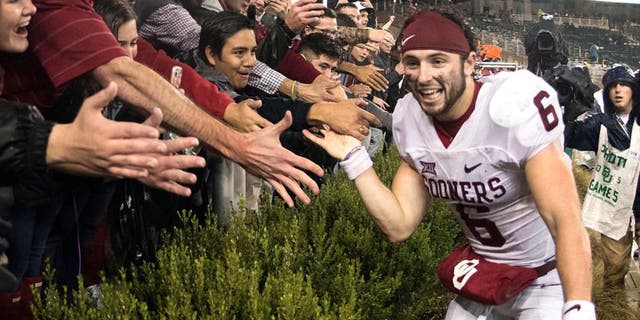 Nov 14, 2015; Waco, TX, USA; Oklahoma Sooners quarterback Baker Mayfield (6) celebrates with the Sooner fans after the win over the Baylor Bears at McLane Stadium. The Sooners defeat the Bears 44-34. Mandatory Credit: Jerome Miron-USA TODAY Sports