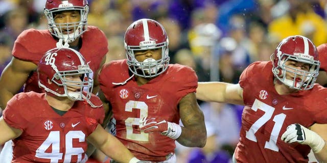 Nov 7, 2015; Tuscaloosa, AL, USA; Alabama Crimson Tide running back Derrick Henry (2) celebrates after touchdown during the second quarter against the LSU Tigers at Bryant-Denny Stadium. Mandatory Credit: Marvin Gentry-USA TODAY Sports