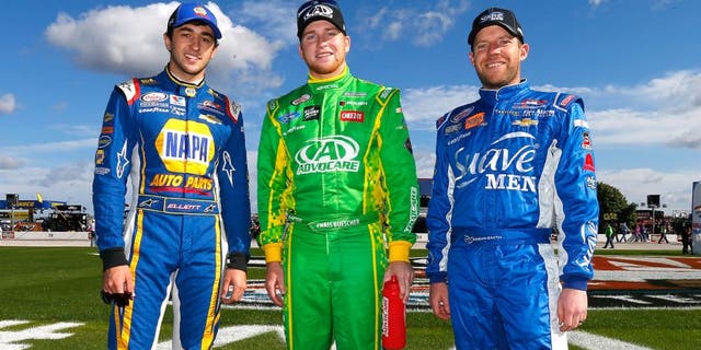 FORT WORTH, TX - NOVEMBER 07: (L-R) Championship contenders Chase Elliott, driver of the #9 NAPA Auto Parts Chevrolet, Chris Buescher, driver of the #60 AdvoCare Ford, and Regan Smith, driver of the #7 Suave Men Chevrolet, pose prior to the NASCAR XFINITY Series O'Reilly Auto Parts Challenge at Texas Motor Speedway on November 7, 2015 in Fort Worth, Texas. (Photo by Jonathan Ferrey/Getty Images for Texas Motor Speedway)