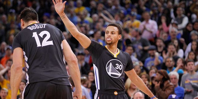 Nov 14, 2015; Oakland, CA, USA; Golden State Warriors guard Stephen Curry (30) reacts after the Warriors force a turnover against the Brooklyn Nets in overtime at Oracle Arena. The Warriors defeated the Nets 107-99. Mandatory Credit: Cary Edmondson-USA TODAY Sports