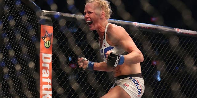 MELBOURNE, AUSTRALIA - NOVEMBER 15: Holly Holm of the United States celebrates victory over Ronda Rousey of the United States in their UFC women's bantamweight championship bout during the UFC 193 event at Etihad Stadium on November 15, 2015 in Melbourne, Australia. (Photo by Quinn Rooney/Getty Images)