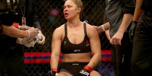 MELBOURNE, AUSTRALIA - NOVEMBER 15: Ronda Rousey of the United States receives medical treatment after being defeated by Holly Holm of the United States in their UFC women's bantamweight championship bout during the UFC 193 event at Etihad Stadium on November 15, 2015 in Melbourne, Australia. (Photo by Pat Scala /Zuffa LLC/Zuffa LLC via Getty Images)