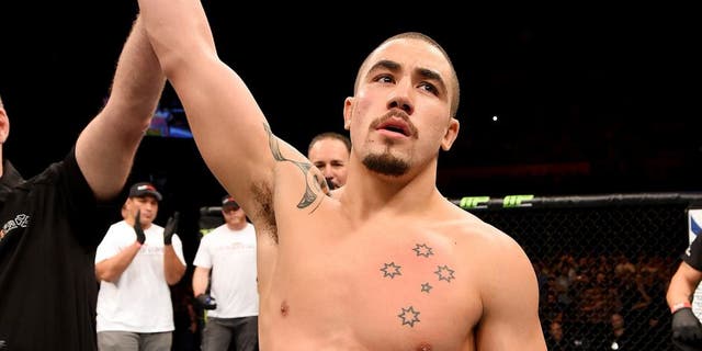 ADELAIDE, AUSTRALIA - MAY 10: Robert Whittaker celebrates his knockout victory over Brad Tavares in their middleweight bout during the UFC Fight Night event at the Adelaide Entertainment Centre on May 10, 2015 in Adelaide, Australia. (Photo by Josh Hedges/Zuffa LLC/Zuffa LLC via Getty Images)
