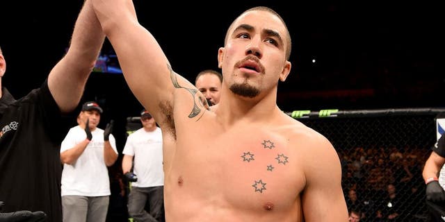 ADELAIDE, AUSTRALIA - MAY 10: Robert Whittaker celebrates his knockout victory over Brad Tavares in their middleweight bout during the UFC Fight Night event at the Adelaide Entertainment Centre on May 10, 2015 in Adelaide, Australia. (Photo by Josh Hedges/Zuffa LLC/Zuffa LLC via Getty Images)