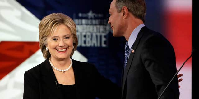 Nov. 14, 2015: Hillary Rodham Clinton shakes hands with Martin O'Malley after a Democratic presidential primary debate in Des Moines, Iowa.