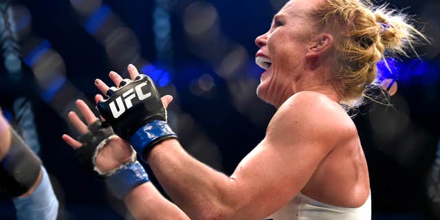 Nov. 15, 2015: Holly Holm celebrates after defeating Ronda Rousey during their UFC 193 bantamweight title fight in Melbourne, Australia