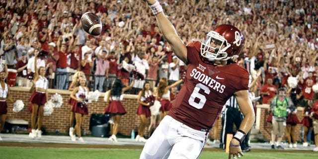 NORMAN, OK - SEPTEMBER 5: Quarterback Baker Mayfield #6 of the Oklahoma Sooners celebrates a touchdown against the Akron Zips September 5, 2015 at Gaylord Family-Oklahoma Memorial Stadium in Norman, Oklahoma. Oklahoma defeated Akron 41-3.(Photo by Brett Deering/Getty Images)