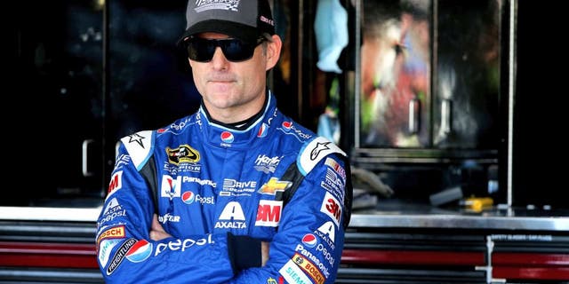 AVONDALE, AZ - NOVEMBER 14: Jeff Gordon, driver of the #24 Pepsi Chevrolet, stands in the garage area during practice for the NASCAR Sprint Cup Series Quicken Loans Race for Heroes 500 at Phoenix International Raceway on November 14, 2015 in Avondale, Arizona. (Photo by Sean Gardner/Getty Images)