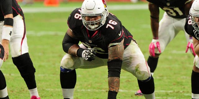 Oct 4, 2015; Glendale, AZ, USA; Arizona Cardinals guard Mike Iupati (76) looks on prior to the snap during the second half against the St. Louis Rams at University of Phoenix Stadium. Mandatory Credit: Matt Kartozian-USA TODAY Sports