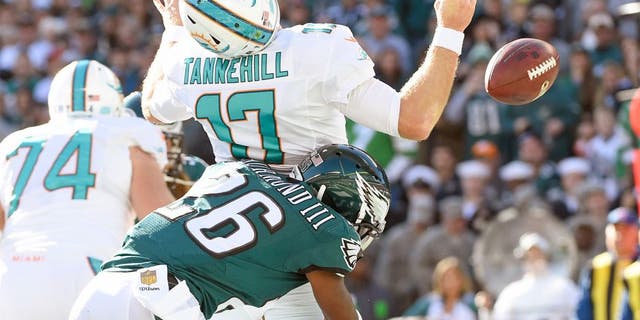 Nov 15, 2015; Philadelphia, PA, USA; Philadelphia Eagles strong safety Walter Thurmond (26) sacks Miami Dolphins quarterback Ryan Tannehill (17) causing a fumble in the end zone for a safety during the first quarter at Lincoln Financial Field. Mandatory Credit: Eric Hartline-USA TODAY Sports