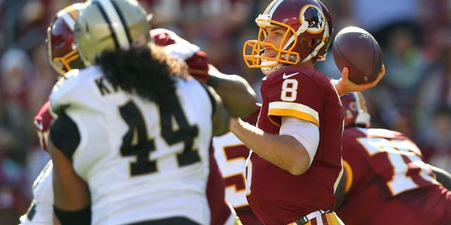 LANDOVER, MD - NOVEMBER 15: Quarterback Kirk Cousins #8 of the Washington Redskins makes a pass against the New Orleans Saints during the first half at FedExField on November 15, 2015 in Landover, Maryland. (Photo by Patrick Smith/Getty Images)