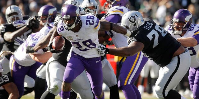 Nov 15, 2015; Oakland, CA, USA; Minnesota Vikings running back Adrian Peterson (28) runs the ball against the Oakland Raiders in the first quarter at O.co Coliseum. Mandatory Credit: Cary Edmondson-USA TODAY Sports